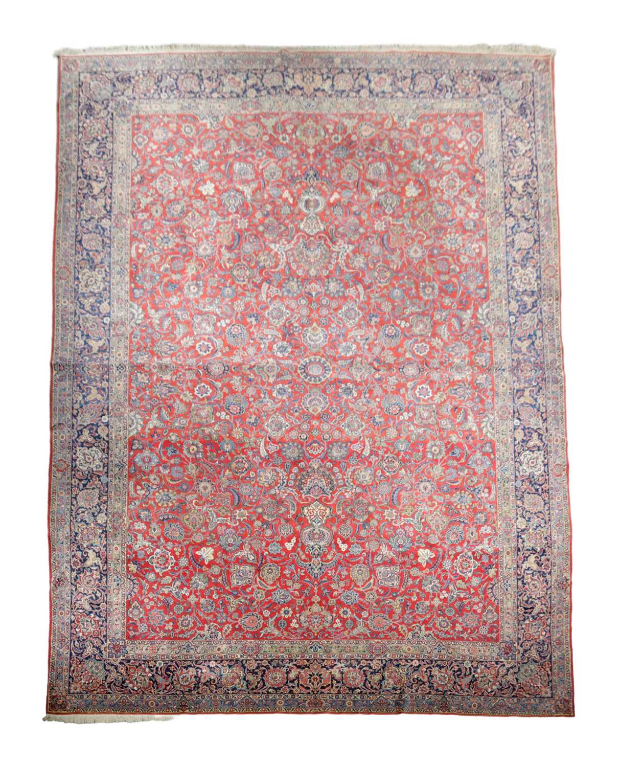 A GOOD KASHAN CARPET CENTRAL PERSIA, C.1940 the abrashed raspberry field with an all over design