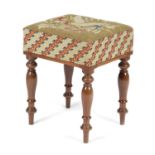 AN EARLY VICTORIAN MAHOGANY STOOL C.1840-50 the probably original needlework seat on baluster turned