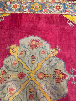 AN USHAK CARPET OF UNUSUAL SIZE CENTRAL WEST ANATOLIA, C.1900 the plain raspberry field centered - Image 9 of 14