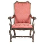 A FRENCH OAK ARMCHAIR IN 17TH CENTURY STYLE, C.1870, the shaped rectangular and upholstered back