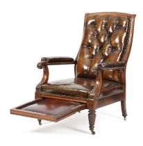 A GEORGE IV MAHOGANY LIBRARY ARMCHAIR C.1830 covered with brass studded leather and with a pull-
