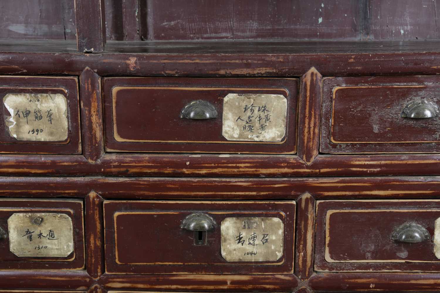 A CHINESE AUBERGINE LACQUER ELM SHOP DISPLAY CABINET LATE 19TH / EARLY 20TH CENTURY the top - Image 5 of 6