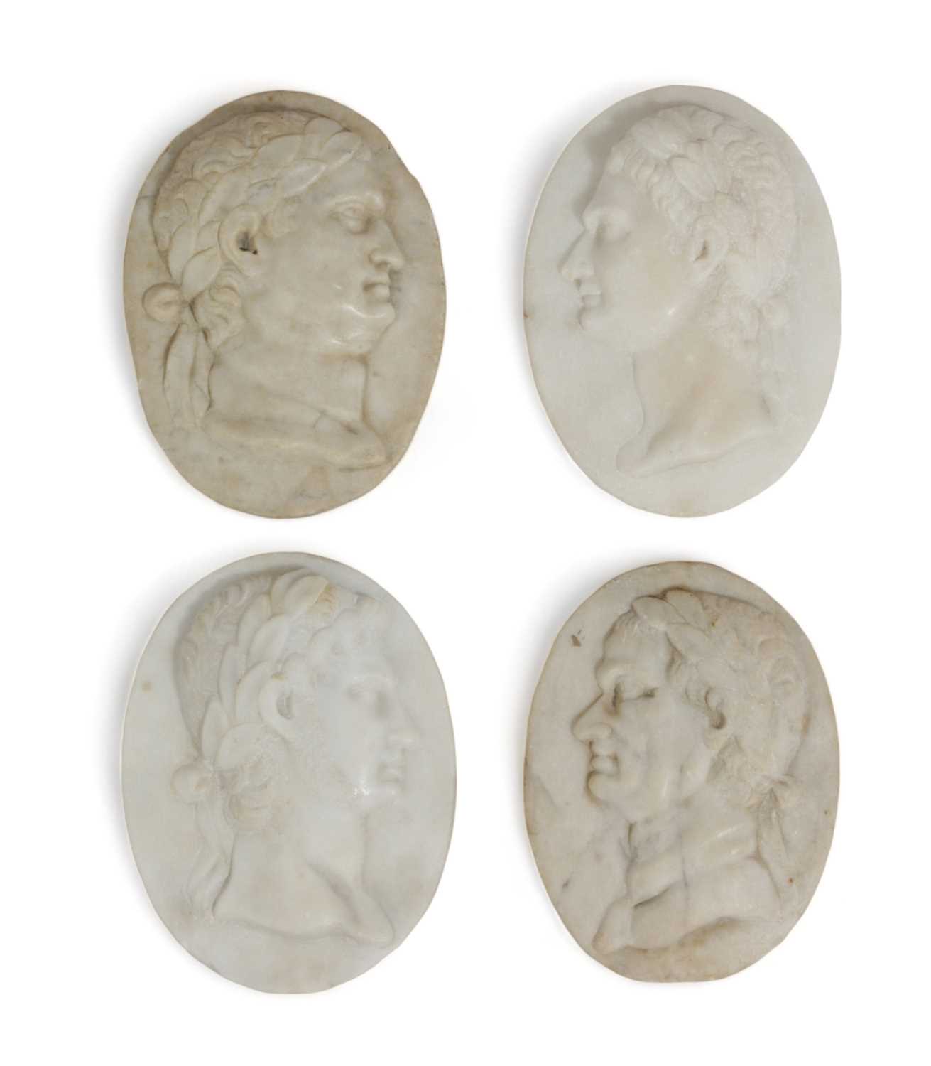 FOUR ITALIAN GRAND TOUR WHITE MARBLE OVAL MEDALLIONS 18TH CENTURY AND LATER depicting Roman Emperors