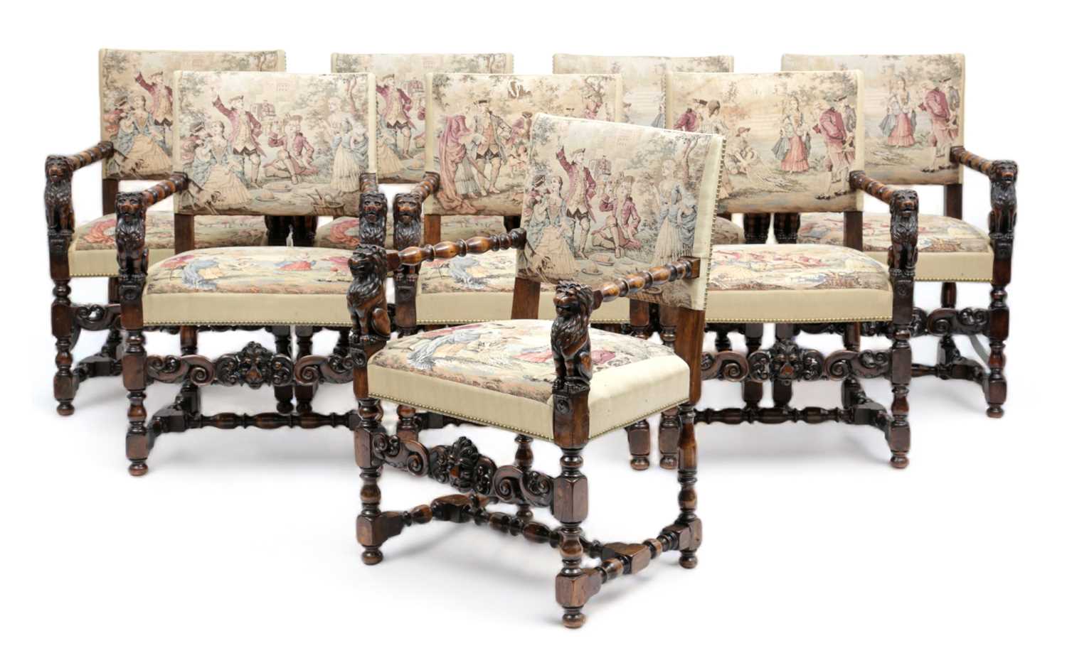 A SET OF EIGHT ITALIAN WALNUT DINING CHAIRS IN RENAISSANCE STYLE, IN THE MANNER OF ANGIOLIO BARBETTI