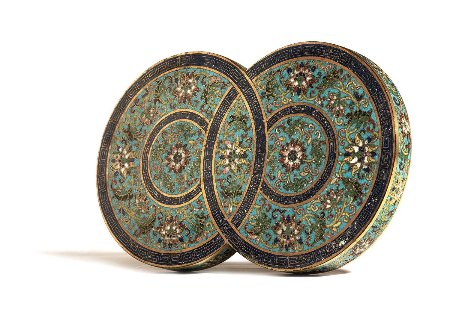 A CHINESE CLOISONNE COVER 18TH / 19TH CENTURY formed as two interlinked circles, decorated with