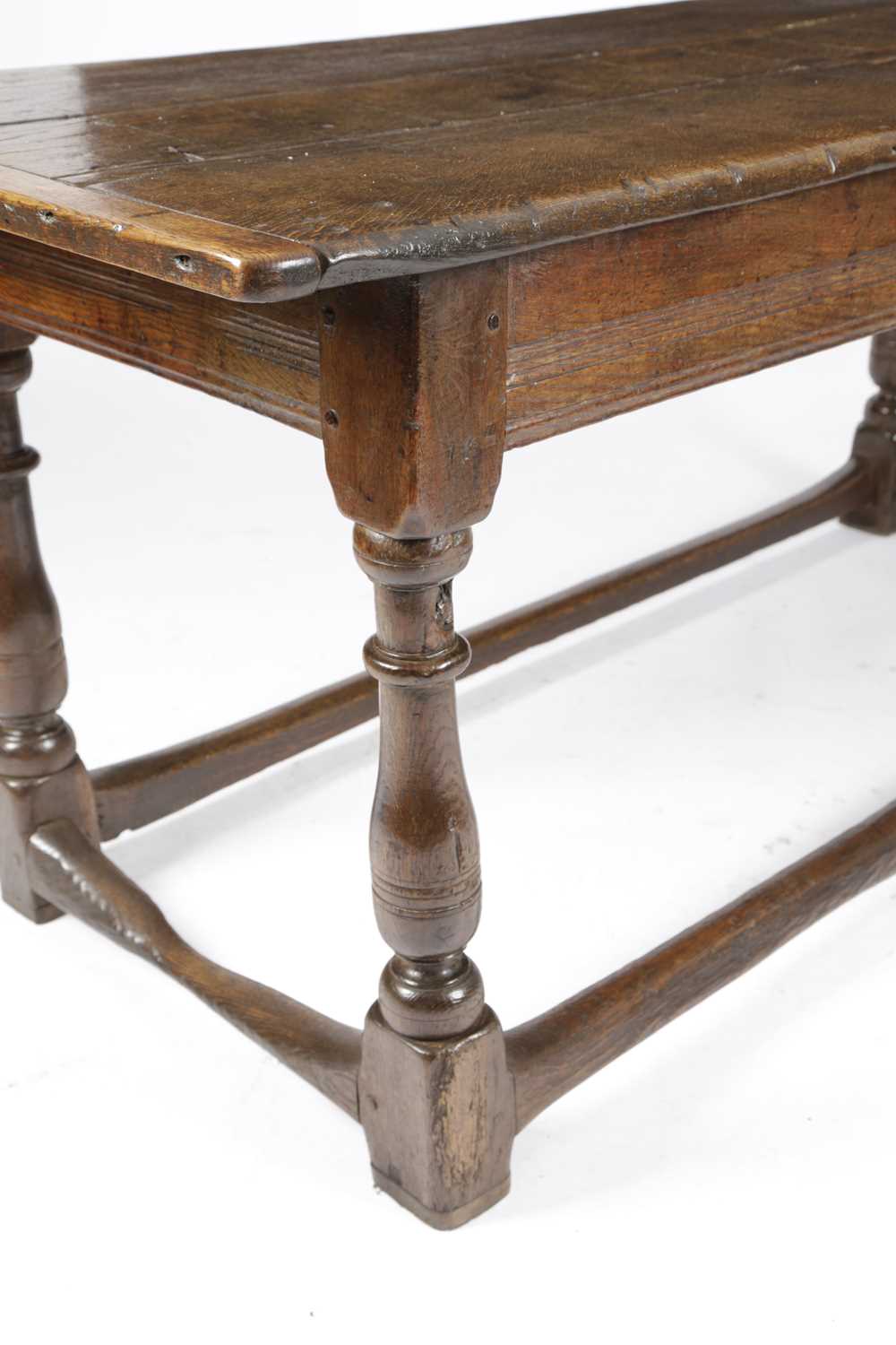 AN OAK REFECTORY TABLE LATE 17TH CENTURY AND LATER the boarded top with cleated ends, above a - Image 2 of 4