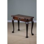 A FINE GEORGE II MAHOGANY CONCERTINA CARD TABLE C.1740-50 the fold-over top revealing a baize