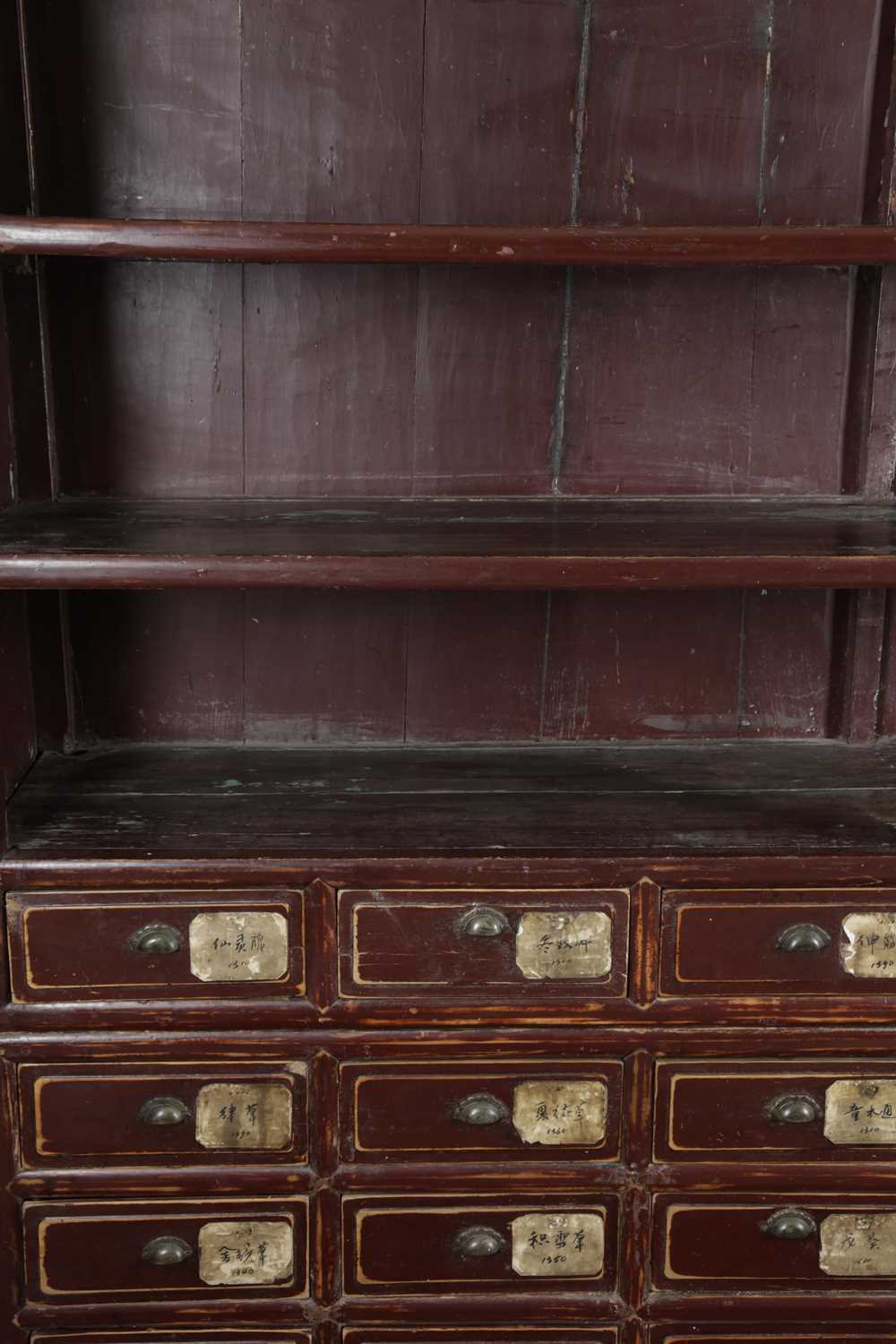 A CHINESE AUBERGINE LACQUER ELM SHOP DISPLAY CABINET LATE 19TH / EARLY 20TH CENTURY the top - Image 3 of 6