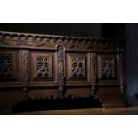 A RARE OAK COFFER POSSIBLY FLEMISH, C.1640 the twin panelled top with scrolling iron strap hinges,