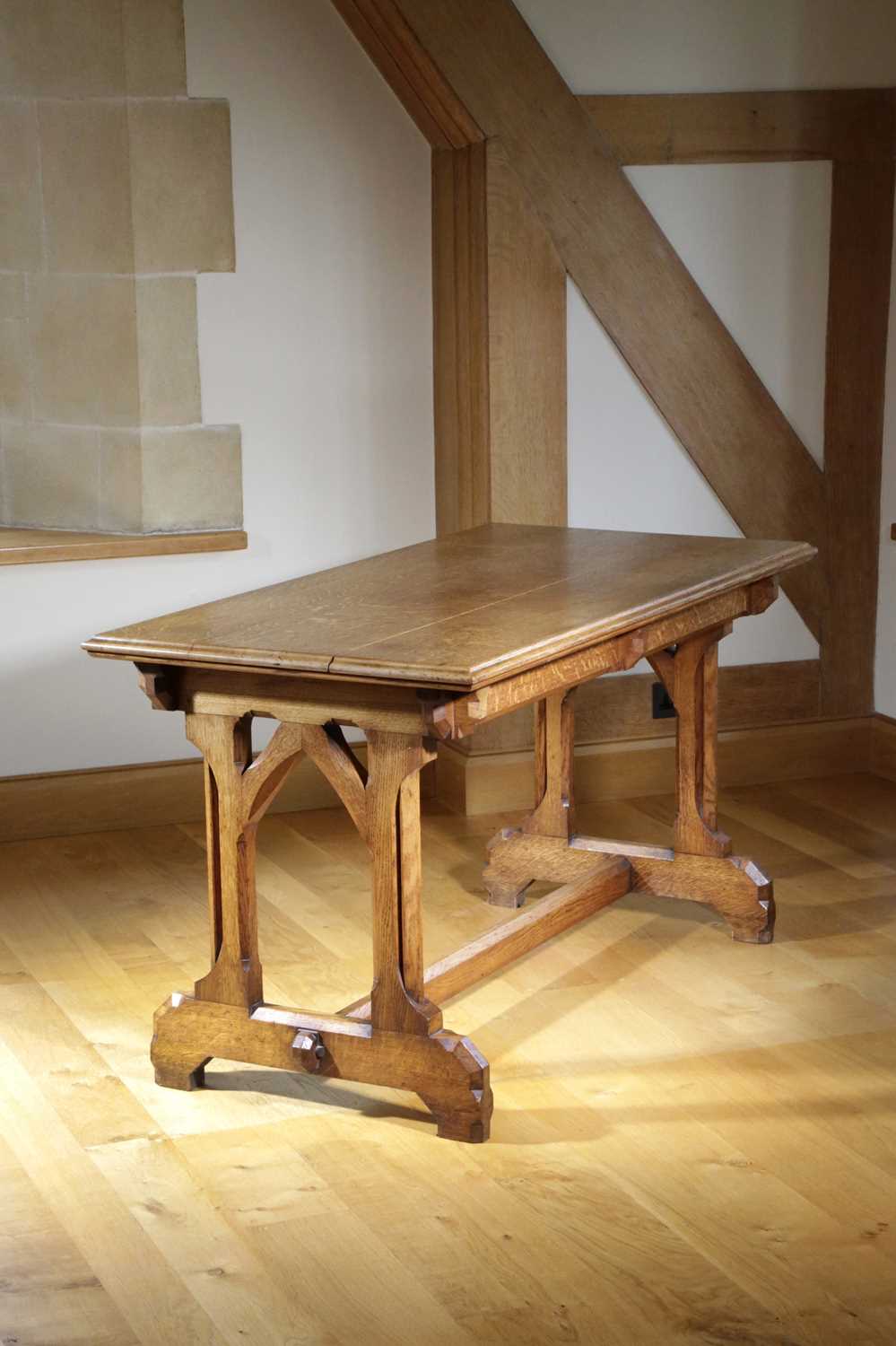 A VICTORIAN OAK GOTHIC REVIVAL WRITING TABLE IN THE MANNER OF A.W.N. PUGIN, C.1870 the rectangular