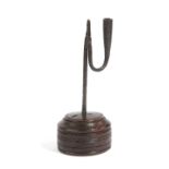 A WROUGHT IRON TABLE RUSHNIP AND CANDLEHOLDER 18TH CENTURY AND LATER with bird's beak jaws and a 'U'