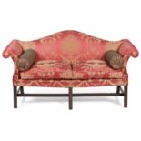 A GEORGE III MAHOGANY SOFA C.1760 the serpentine back above scrolling arms, above serpentine seat