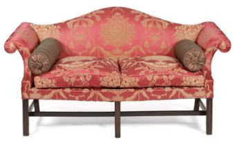 A GEORGE III MAHOGANY SOFA C.1760 the serpentine back above scrolling arms, above serpentine seat