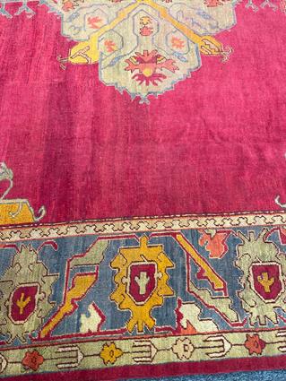 AN USHAK CARPET OF UNUSUAL SIZE CENTRAL WEST ANATOLIA, C.1900 the plain raspberry field centered - Image 3 of 14