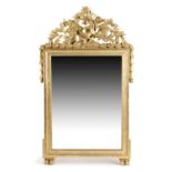 A FRENCH GILTWOOD MIRROR IN LOUIS XVI STYLE, 19TH CENTURY the rectangular plate within a moulded