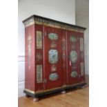 A NORTH EUROPEAN PAINTED MARRIAGE ARMOIRE POSSIBLY TYROLEAN, EARLY 19TH CENTURY, DATED '1811' with a