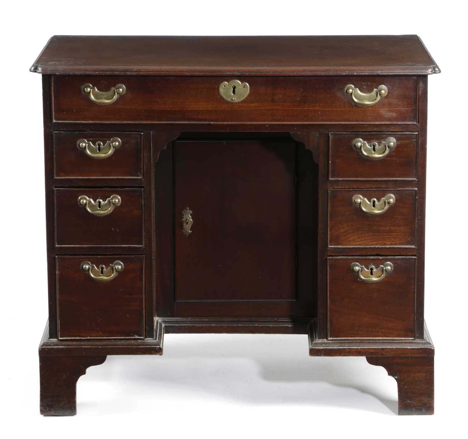 A GEORGE II MAHOGANY KNEEHOLE DESK C.1750-60 the caddy moulded edge top with re-entrant front