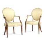 A PAIR OF GEORGE III MAHOGANY ARMCHAIRS LATE 18TH CENTURY each with a padded back, seat and