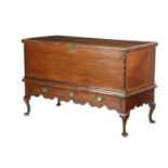 A RARE BERMUDAN CEDAR TRUNK ON STAND MID-18TH CENTURY the hinged top revealing a vacant interior,