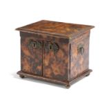 A REGENCY FAUX TORTOISESHELL PYROGRAPHY TABLE CABINET EARLY 19TH CENTURY the hinged cover