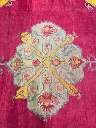 AN USHAK CARPET OF UNUSUAL SIZE CENTRAL WEST ANATOLIA, C.1900 the plain raspberry field centered - Image 6 of 14