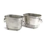A PAIR OF FRENCH POLISHED STEEL JARDINIERES OR WINE COOLERS EARLY 20TH CENTURY of oval form with