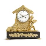 A FRENCH GILT AND PATINATED BRONZE MANTEL CLOCK EARLY 19TH CENTURY the brass eight day movement with