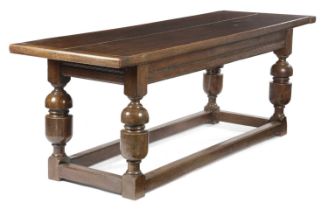AN OAK REFECTORY DINING TABLE IN JACOBEAN STYLE, EARLY 20TH CENTURY the boarded top with cleated