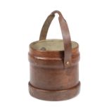 A LEATHER SHELL CARRIER WASTE PAPER BASKET EARLY 20TH CENTURY with a swing handle 34.2cm high, 36.