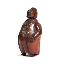 A COQUILLA NUT FIGURAL SNUFF BOX OF A PORTLY MAN PROBABLY FRENCH, LATE 18TH / EARLY 19TH CENTURY