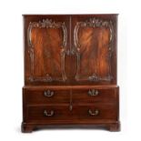 A RARE EARLY GEORGE III MAHOGANY LINEN PRESS IN THE MANNER OF THOMAS CHIPPENDALE, C.1760 the moulded