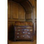 A GEORGE I WALNUT BUREAU BY WILLIAM OLD AND JOHN ODY, C.1725 with cross and feather banding, the