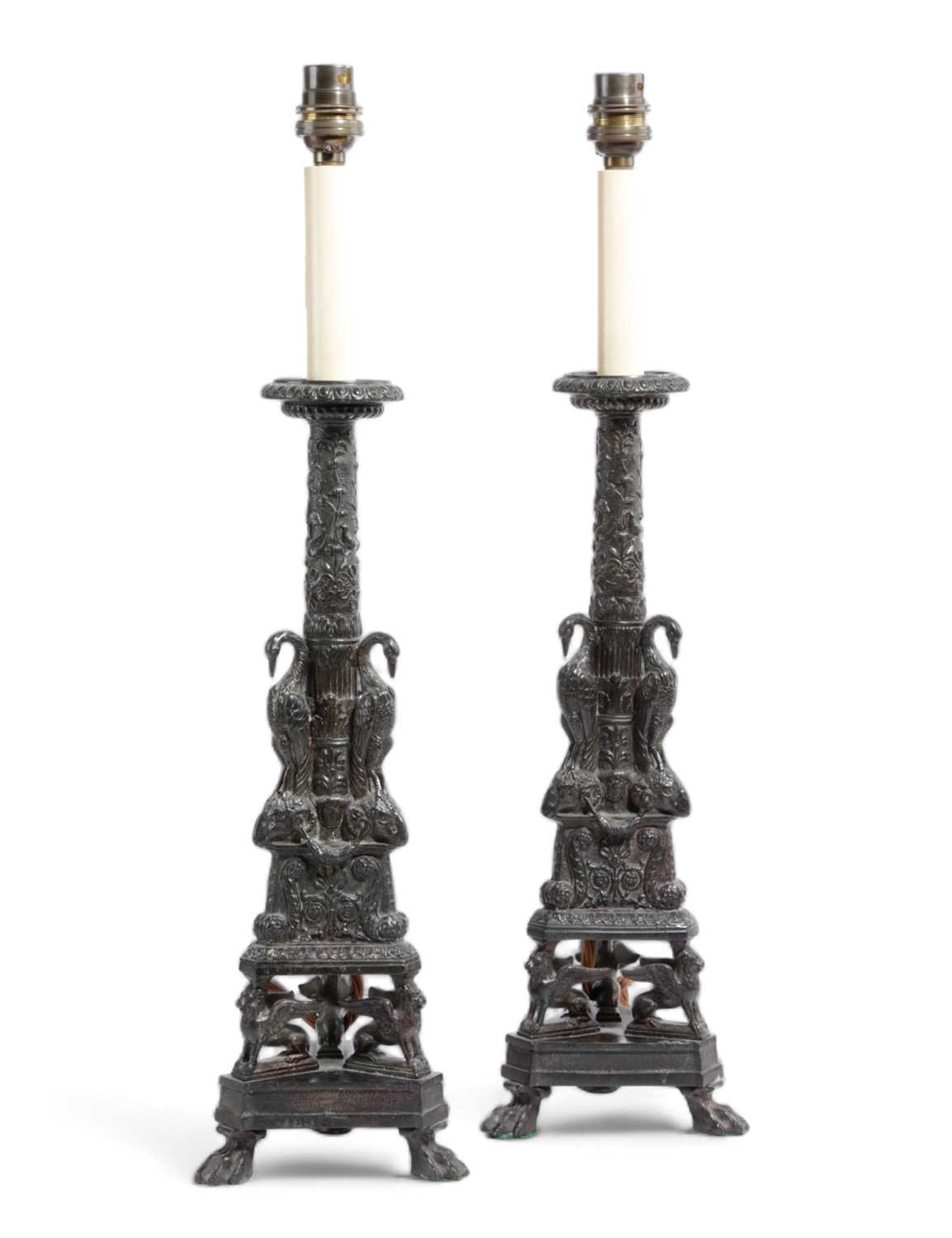 A PAIR OF BRONZE HELLENISTIC STYLE CANDLESTICKS AFTER THE MODEL BY GIOVANNI-BATTISTA PIRANESI (