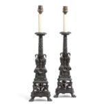 A PAIR OF BRONZE HELLENISTIC STYLE CANDLESTICKS AFTER THE MODEL BY GIOVANNI-BATTISTA PIRANESI (