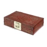 A CHINESE RED LEATHER ARTIST'S BOX QING DYNASTY with tooled decoration of flowers, leaves and