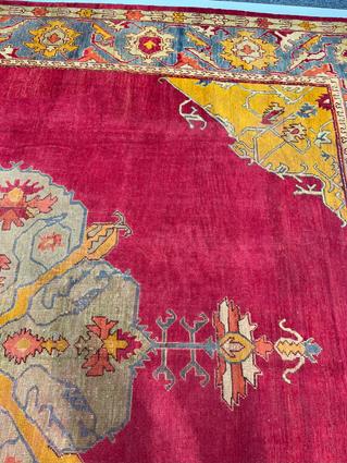 AN USHAK CARPET OF UNUSUAL SIZE CENTRAL WEST ANATOLIA, C.1900 the plain raspberry field centered - Image 10 of 14