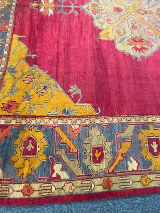 AN USHAK CARPET OF UNUSUAL SIZE CENTRAL WEST ANATOLIA, C.1900 the plain raspberry field centered - Image 14 of 14