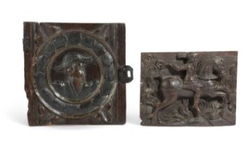 A CARVED OAK PANEL 17TH CENTURY depicting a horse and rider before flames and a Romayne style
