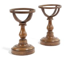 A PAIR OF OAK GLOBE STANDS LATE 19TH OR EARLY 20TH CENTURY to fit 4inch globes, each with a basket