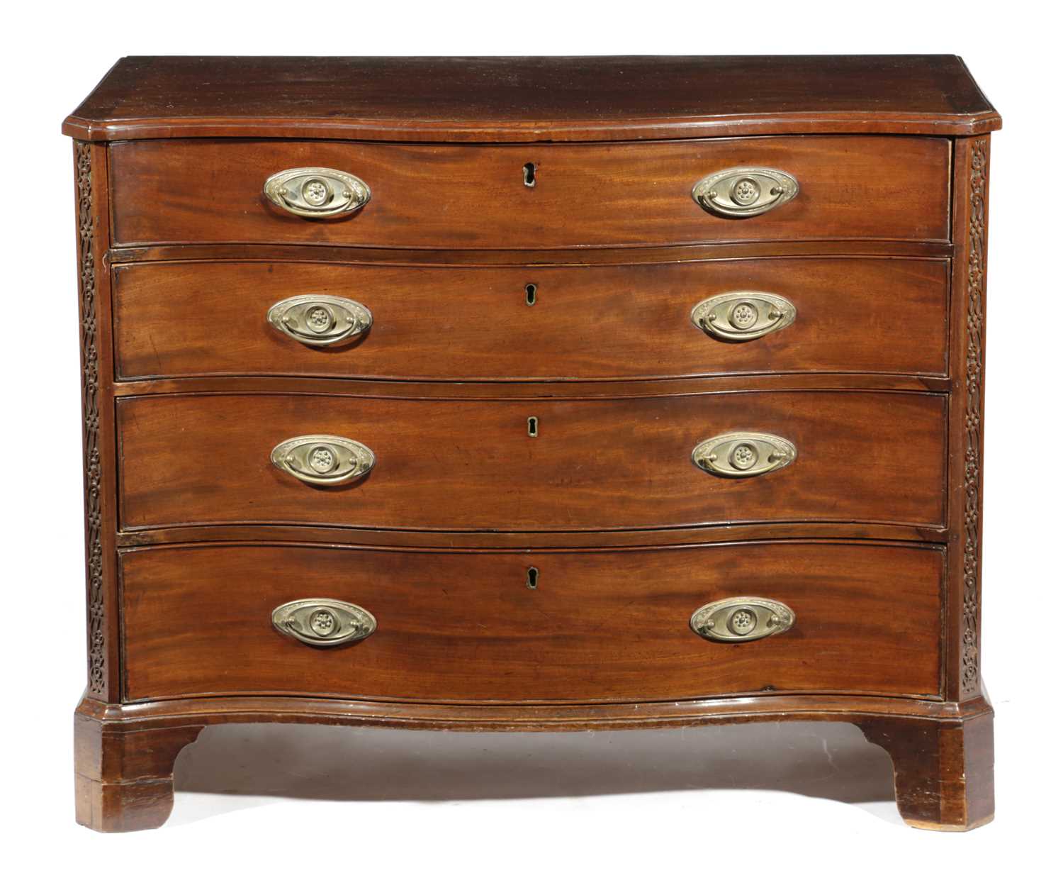 A GEORGE III MAHOGANY SERPENTINE CHEST C.1770-80 with four long drawers flanked by blind fret canted