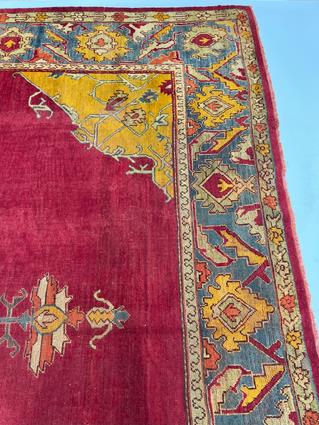 AN USHAK CARPET OF UNUSUAL SIZE CENTRAL WEST ANATOLIA, C.1900 the plain raspberry field centered - Image 11 of 14
