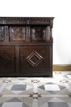 AN OAK COURT CUPBOARD LEEDS, YORKSHIRE, 17TH CENTURY AND LATER the frieze with scrolling fruiting