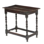 A QUEEN ANNE OAK CENTRE TABLE EARLY 18TH CENTURY with turned baluster cup and cover supports 66.