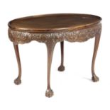 AN IRISH MAHOGANY OVAL SILVER TABLE IN GEORGE II STYLE, EARLY 20TH CENTURY the dished top above a