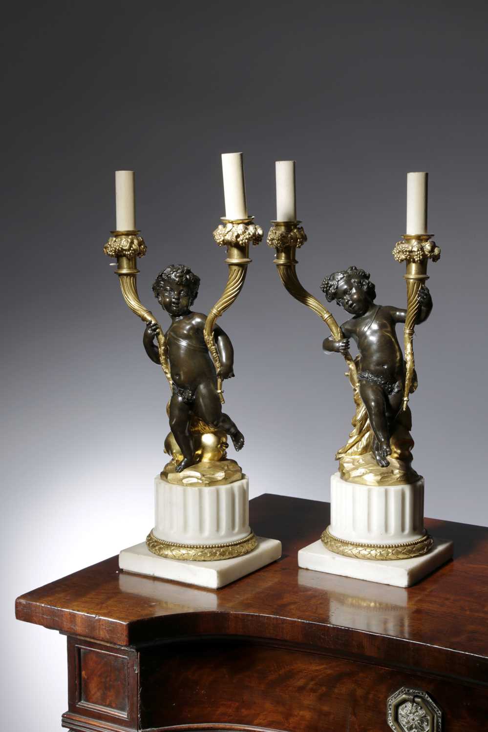 A PAIR OF FRENCH LOUIS XVI GILT AND PATINATED BRONZE CANDELABRA AFTER CLAUDE MICHEL, KNOWN AS - Image 2 of 2