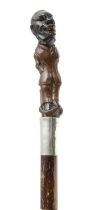 AN EDWARDIAN FOLK ART SWORD STICK EARLY 20TH CENTURY the handle carved as an Afro-Caribbean man