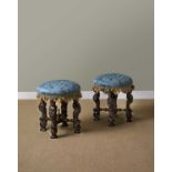A RARE PAIR OF CHARLES II WALNUT STOOLS C.1685 each with a circular blue silk damask seat on four