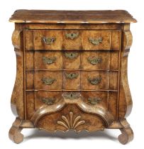 A DUTCH BURR WALNUT COMMODE 18TH CENTURY the archer's bow moulded edge top above four long ripple