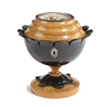 A FRENCH FRUITWOOD AND EBONISED TEA CADDY EARLY 19TH CENTURY of flowerhead form, the cover with a