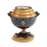 A FRENCH FRUITWOOD AND EBONISED TEA CADDY EARLY 19TH CENTURY of flowerhead form, the cover with a